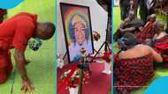 Mourners bow and sit on the floor to mourn Kantanka in front of his framed photo, video stirs reactions