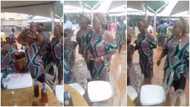 People continue to enjoy themselves as rainfall floods their party venue; many react to video