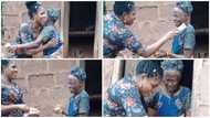 Young lady visits woman who is over 100 years old & sprays cash on her in video