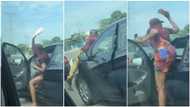 Lady steps out of her car to flog kids wiping her windscreen in traffic in viral video