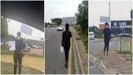 Female Law Graduate Hits the Street with Placard and CV in Search of Job