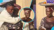 Street hawker delights as kind ghanaian man gifts her cash, netizens react to video