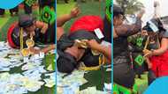 Ghanaian woman 'swims' in money at a funeral, viral video excites many