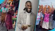 Burna Boy: Loud cheers in video as Makola market women overjoyed over billboard gift from Nigerian singer