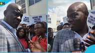 Haruna Idrissu faces picketing teachers at the Ministry of Education premises