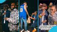 Shatta Wale smiles brightly as Popcaan speaks to him in heavy patois