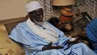 Man ‘challenges’ Chief Imam; checks bet slip under billboard which says betting is evil (Photo)