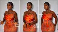 Hajia Bintu slays in orange corset dress, displays fire dance moves in video