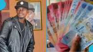 Lil Win delights school kids as he sprays mountain of cash for them to pick up, video