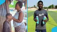 Ghanaian woman prays for her footballer son while watching him on TV