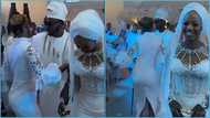 Ghanaian lady hooks groom on dancefloor as wife waits, video trends: "She's probably a side chick"