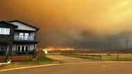 Parts of Canadian city in oil sands region evacuated as wildfire draws near