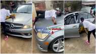 Young man gets new Benz, his mum rejoices as she uses her cloth to clean car, sleeps on it