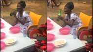 Elderly GH woman boldly enjoys beer at funeral in video, netizen react: “Give grandma glass”