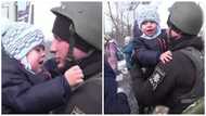 Little Ukrainian boy cries as his dad who is a police officer leaves for war in emotional video