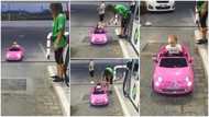 Cute video goes viral as baby drives toy car to fuel station & pays to buy fuel