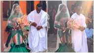 Beautiful Ghanaian bride dons kente for her white wedding ceremony, internet users react