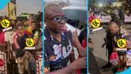 Shatta Wale’s manager Sammy Flex shares drinks and water to fans after his release from EOCO
