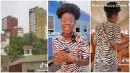 Lady enjoys herself in Accra as she shares her train ride experience and sees colourfully painted tall buildings