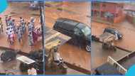 Pastor and wife chill inside V8 while church members march in the rain, peeps react to TikTok video