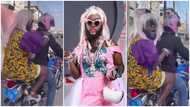 DJ Azonto climbs okada in heels, flaunts diamond necklace and gold anklet in video