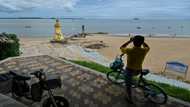 A stone's throw from Taiwan, beachgoers aren't worried about war