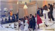 Pretty wedding guest rocking white dress falls while trying to catch bouquet