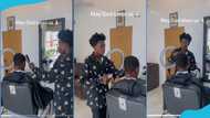 Strongman turns barber in trending video, barbs man's hair