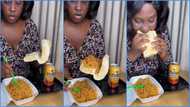 Ghanaian lady causes stir as video of her eating bread with noodles trends: "What hunger can do"
