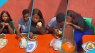 Video trends as fine lady stuns male challenger in eating competition: "Swallows banku with ease"