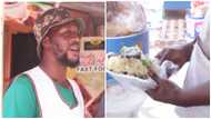 Handsome man who sells waakye rubbishes idea of travelling abroad for greener pastures, “I am okay in Ghana”