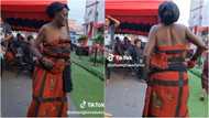 Elderly Ghanaian woman wiggles her waist with energy as she dances with energy at a funeral: "Imagine her youthful days"