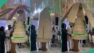 People react as wedding cake comes down from "heaven" and opens "wings": "Wonders shall never end"