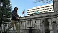 Bank of Japan holds rates, warning of trade uncertainty