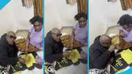 Bukom Banku and his wife Akorkor Martha sit on the floor to enjoy their meal, video causes a stir