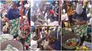 Video drops as grateful son storms market with cake and music to celebrate his okra seller mother on her birthday