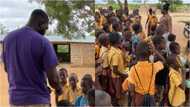 Kind woman gives lunch, school supplies and backpacks to pupils in Volta school