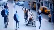 Video shows young man getting robbed in broad daylight while making call