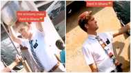 Ghanaians react to 2 foreign nationals fetching water with shirt and tie, video goes viral
