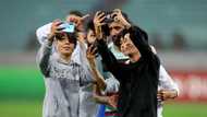 Bruno Fernandes surrounded by curious pitch invaders during Portugal win over Azerbaijan