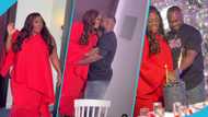 Tracey Boakye kisses her husband passionately as he plans a surprise birthday dinner for her
