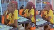 Girl aggressively chews chicken bone at restaurant, video trends online: "Shame no dey her eyes"