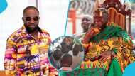 Despite and his son kneel before Otumfuo at his automobile museum launch