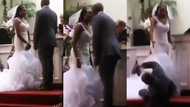 Groom leaves guests in fear as he falls flat under the anointing after kissing bride at their wedding in video