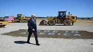 Gripes over electric car tax credit as Biden visits Detroit show