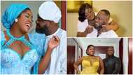 Tracey Boakye and her husband pose together in matching white shirts and denim jeans: "Odo y3 wo d3 dodo"