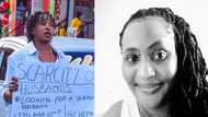 Beautiful frustrated woman hits the streets with placard in search of husband