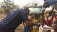 Beautiful photo pops up of police chief offering water to children displaced in Chereponi conflict