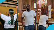 John Dumelo and his wife go on their knees in church and pray to God in new photos