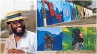 Creative man showcases his skill as he makes fine arts on wall, people praise him